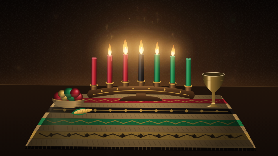 Kinara Light: a kinara with black, red and green candles on a woven mat beside corn and a unity cup